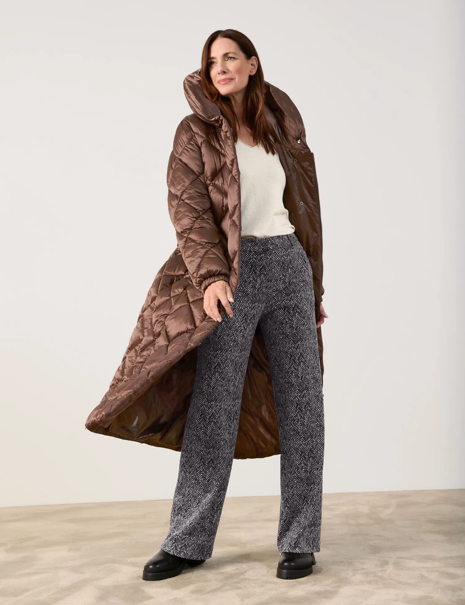 Long quilted coat with a waist belt