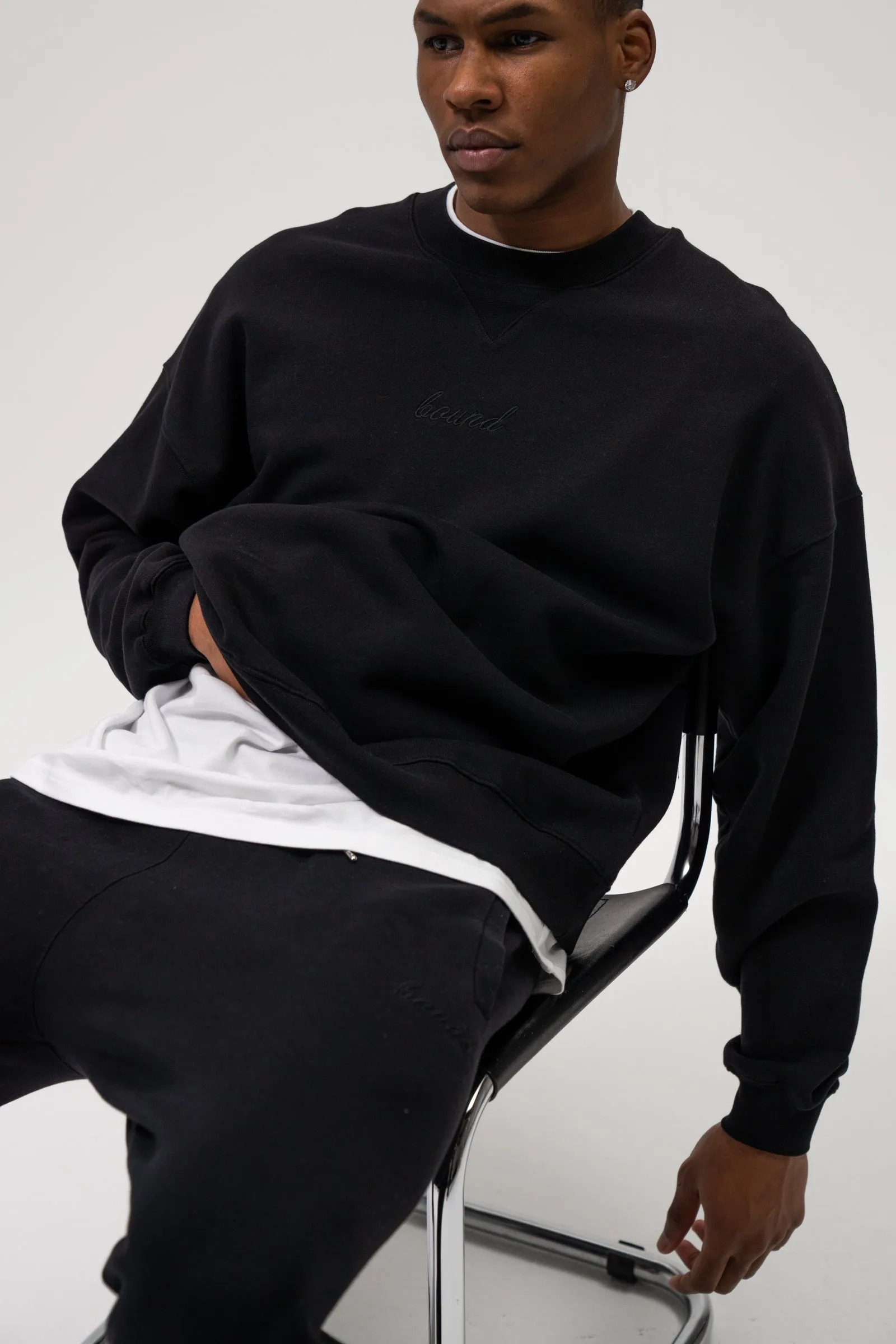 SUSTAIN BLACK SWEATER